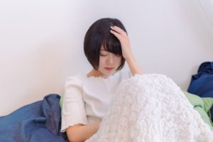 好転反応に苦しむ女性